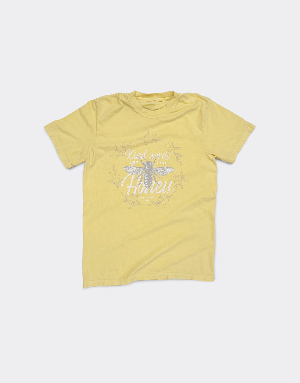 Christian shirt displaying a bee and the phrase "Kind words are like honey"