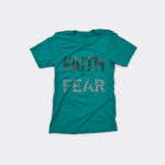 Christian shirt displaying the statement faith over fear